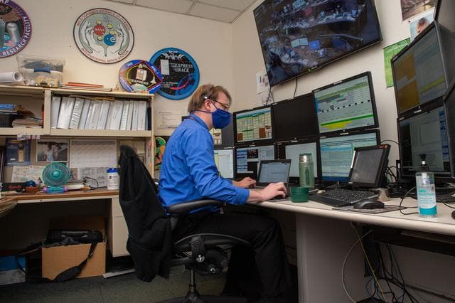 NASA image: A look inside the International Space Station Payload Operations Integration Center at NASA’s Marshall Space Flight Center in Huntsville, AL.  The POIC team supports science operations on the International Space Station 24 hours a day, 7 days a week. For more than 20 years the POIC team has worked with scientists from around the world to enable the space station crew to conduct experiments that improve life on Earth and enable future exploration.