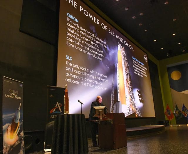 John Honeycutt, SLS Program Manager gives ARTEMIS update to audience at Chamber Media Briefing at USSRC, 2 of 4