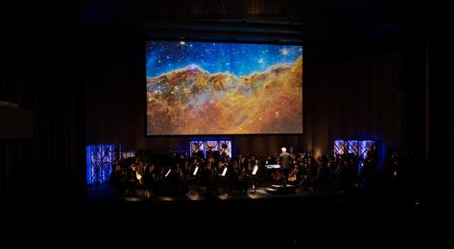 NASA image: National Philharmonic Performs Cosmic Cycles: A Space Symphony