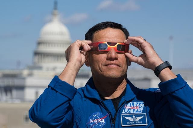 NASA image: Expedition 69 Crew Wears Solar Eclipse Glasses