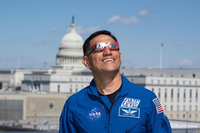 NASA image: Expedition 69 Crew Wears Solar Eclipse Glasses