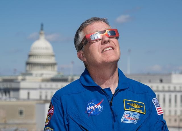 NASA image: Expedition 69 Crew Wears Solar Eclipse Glasses