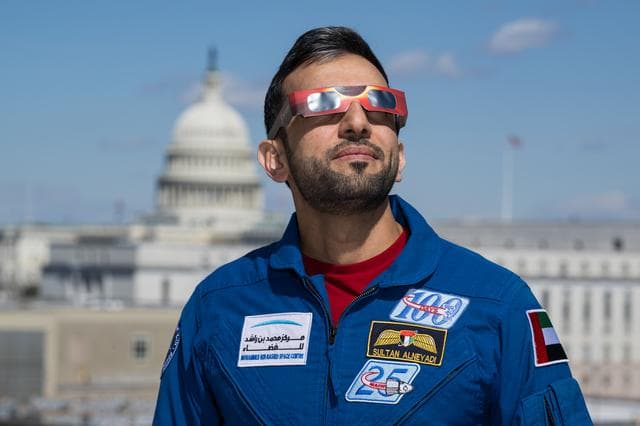NASA image: Expedition 69 Crew Wears Solar Eclipse Glasses