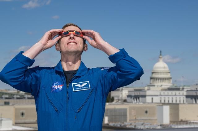 NASA image: Expedition 69 Crew Wears Solar Eclipse Glasses