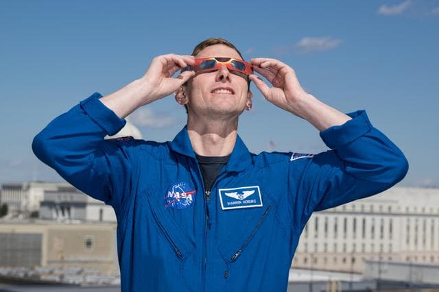 NASA image: Expedition 69 Crew Wears Solar Eclipse Glasses