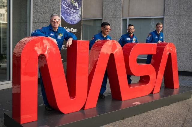 NASA image: Expedition 69 Crew Wears Solar Eclipse Glasses