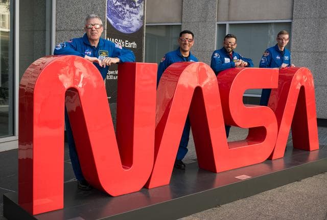 NASA image: Expedition 69 Crew Wears Solar Eclipse Glasses