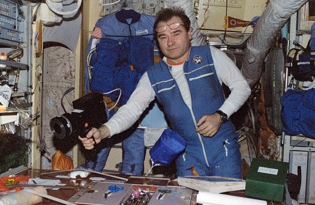 NASA image: Strekalov in Mir Core module with microbial air sampler
