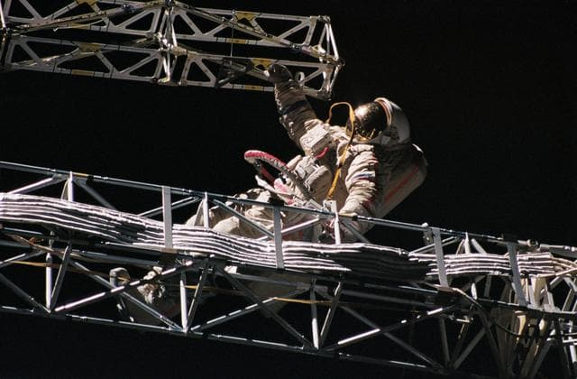 NASA image: Mir 21 cosmonauts assemble a truss during EVA