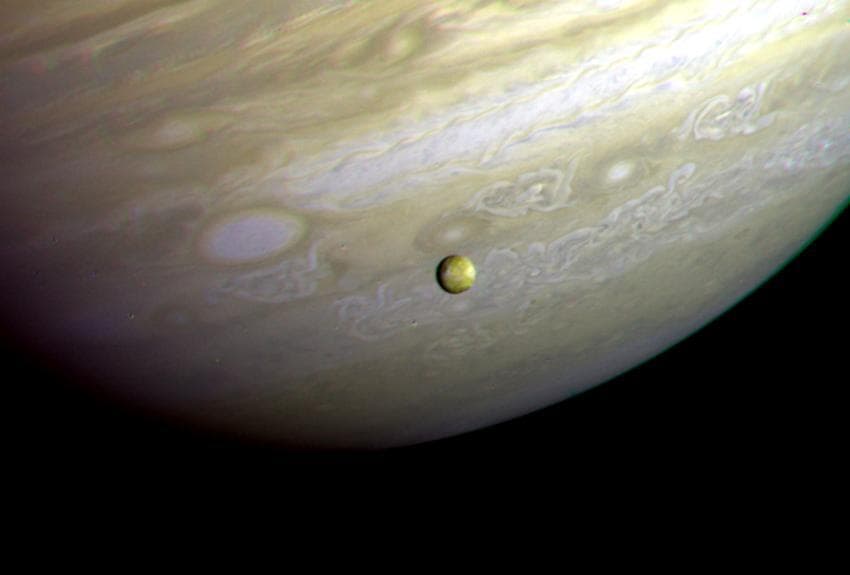 NASA image: Jupiter - Io In Front of Jupiter Turbulent Clouds