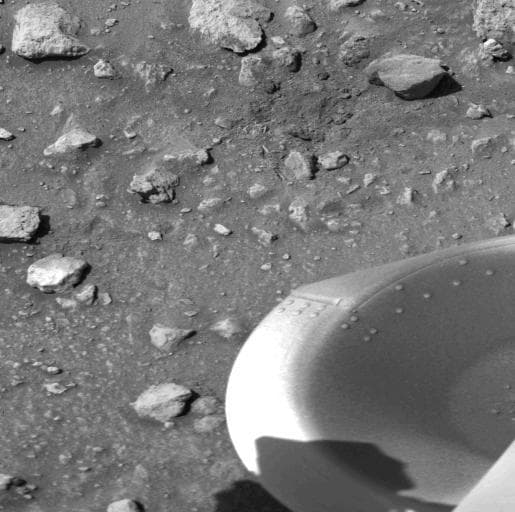 NASA image: Debris Kicked Up By Impact of A Protective Cover from Viking Lander 1