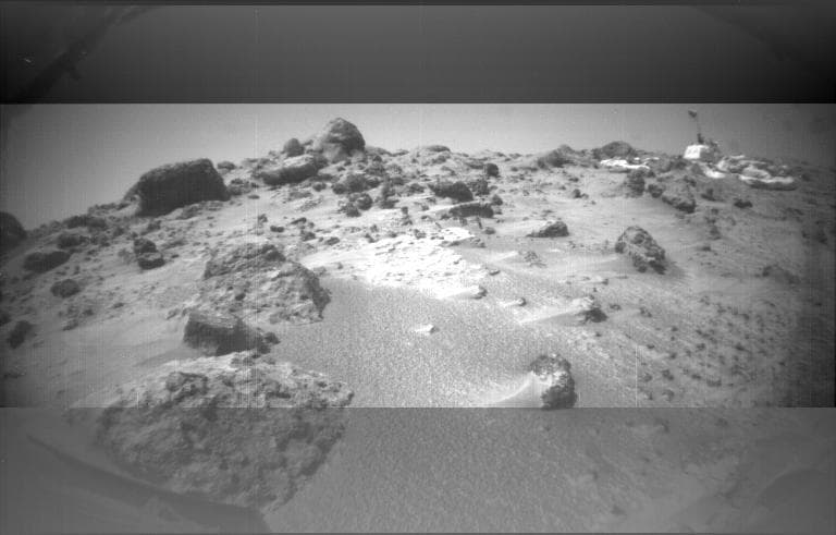 NASA image: Dust Wind Tails Around Rocks