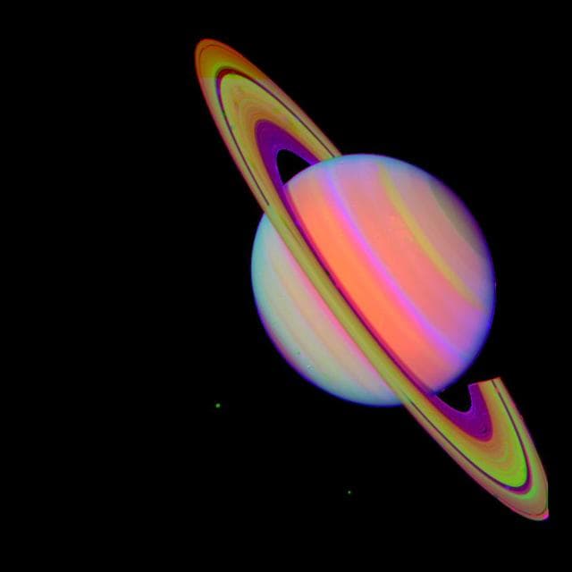 NASA image: Saturn With Rhea and Dione false color