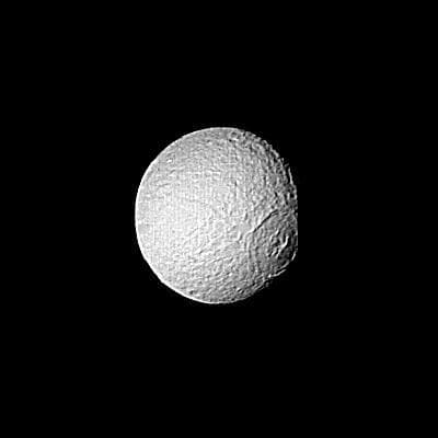 NASA image: Saturn - Large Crater on Tethys