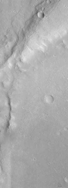NASA image: Eroded Crater Adjacent to Huygens Impact Basin