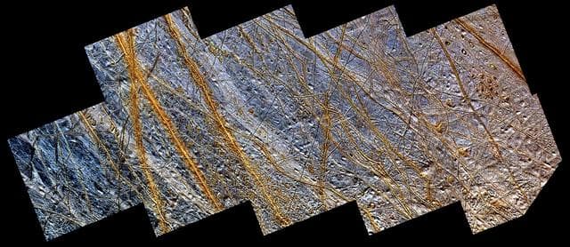 NASA image: Double Ridges, Dark Spots, and Smooth Icy Plains on Europa