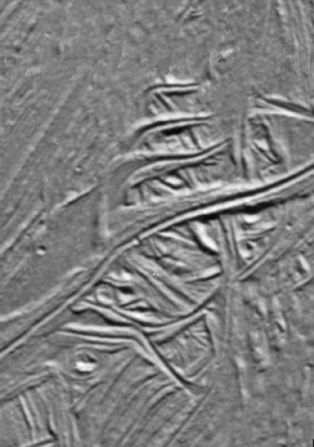 NASA image: Cracks and Ridges Distorted by Europan Fault Motion