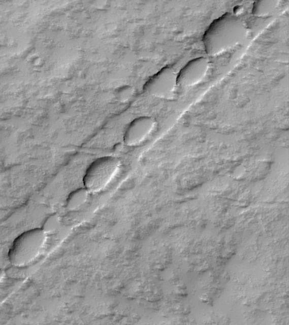 NASA image: Chain of Pits on Pavonis Mons