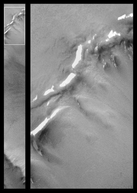 NASA image: Patches of Remnant Frost/Snow on Crater Rim in Northern Summer