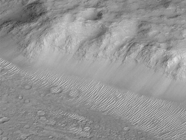 NASA image: Layers of Cratered Highland Bedrock Exposed in Amenthes Slope