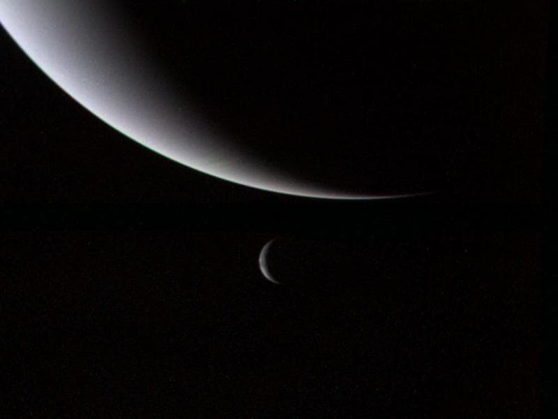NASA image: Crescents of Neptune and Triton