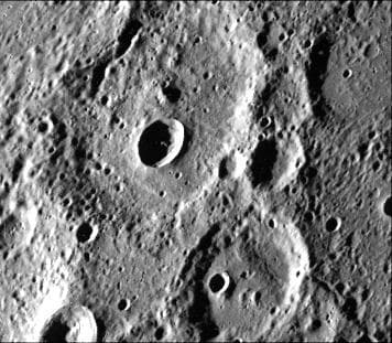NASA image: Fresh Crater in Center of Older Crater Basin