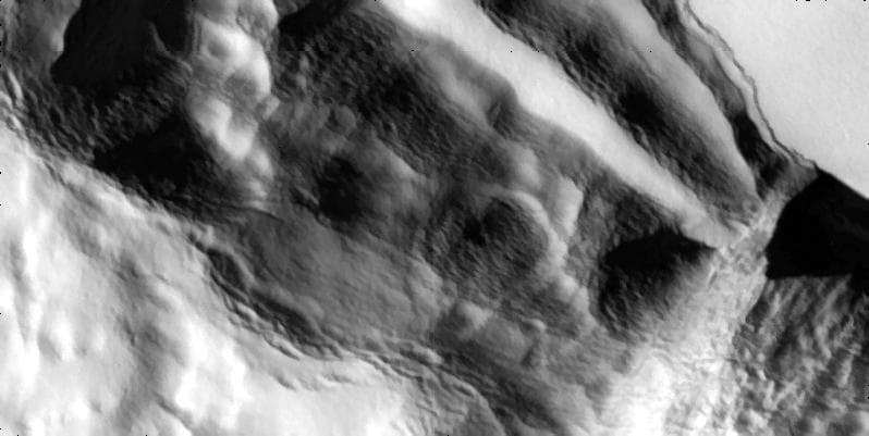 NASA image: Slumping Cliff on Io in High Resolution
