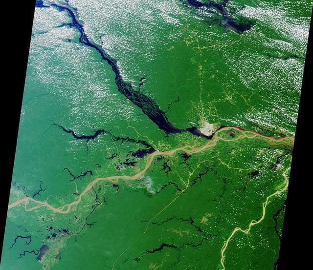 NASA image: A Merging of Pale and Dark