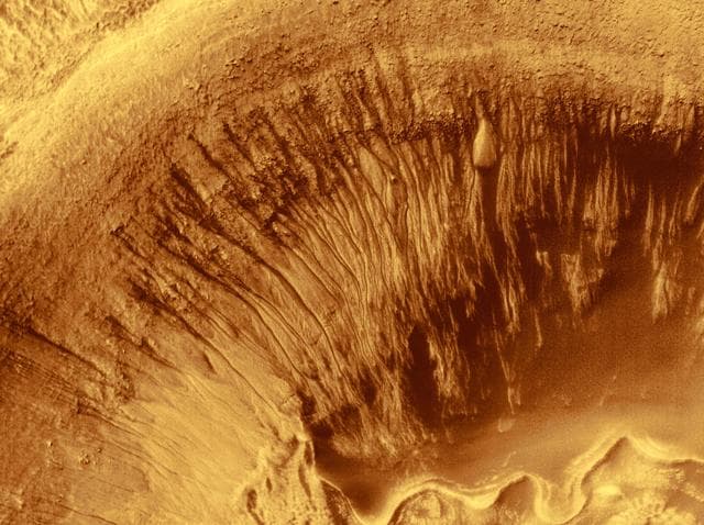 NASA image: Evidence for Recent Liquid Water on Mars: Channeled Aprons in a Small Crater within Newton Crater