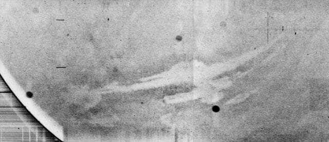 NASA image: Mariner 9 views Canyon System emerging from Martian Dust Storm