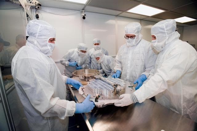 NASA image: Inspecting a Canister and Sample Collector