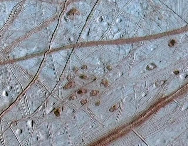NASA image: Ruddy Freckles on Europa