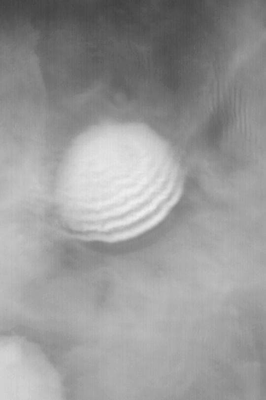 NASA image: Crater with Wavy Fog