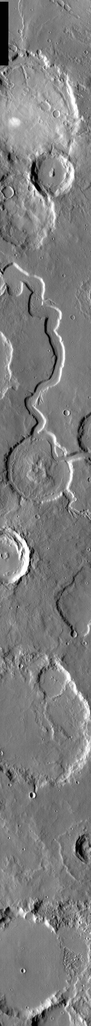 NASA image: Young Channel, Old Crater