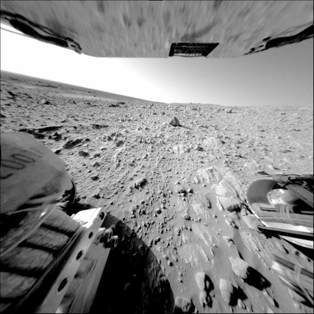 NASA image: Rock Outcrop Under Spirit Wheels