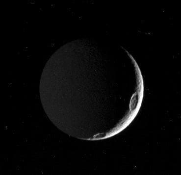NASA image: Tethys in the Dark