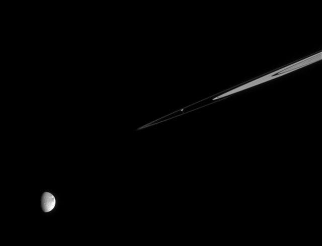 NASA image: Prometheus with Distant Dione