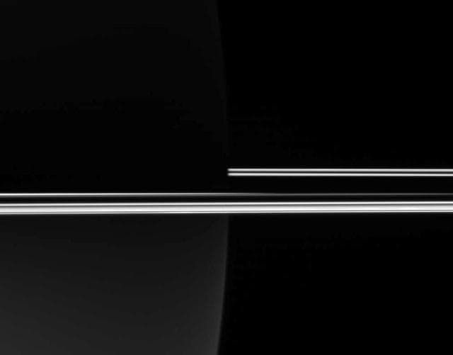 NASA image: Rings Against a Dark Planet