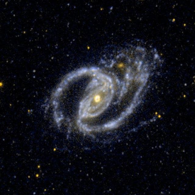 NASA image: A Barred Spiral  Galaxy, and the Small Elliptical Companion Galaxy NGC 1097A