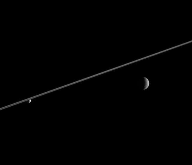 NASA image: Rhea and Enceladus