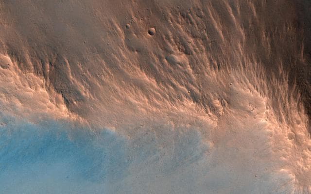 NASA image: A Nine Kilometer Impact Crater and Its Central Peak
