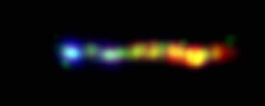 NASA image: Black Hole Spills Kaleidoscope of Color