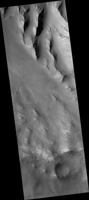 NASA image: Oudemans Crater Central Uplift: A Sample of Well-Preserved Layering   Excavated from Kilometers Below