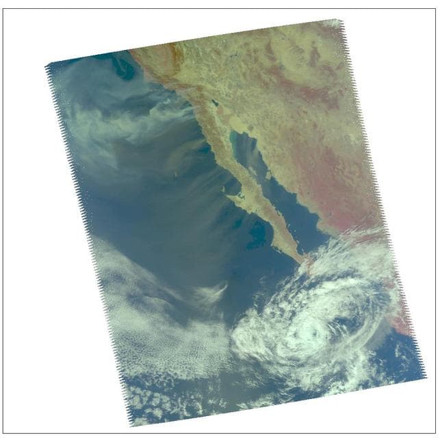 NASA image: Swirls of Smoke and Dust Blow Out to Sea