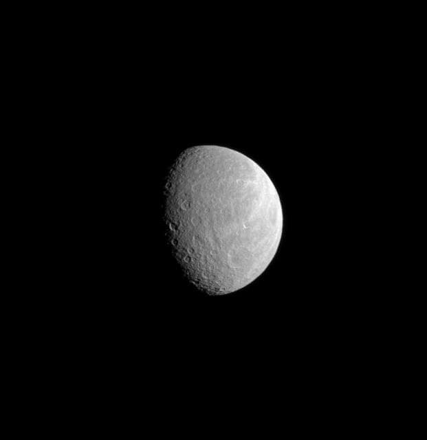 NASA image: Ancient Crater on Wispy Rhea