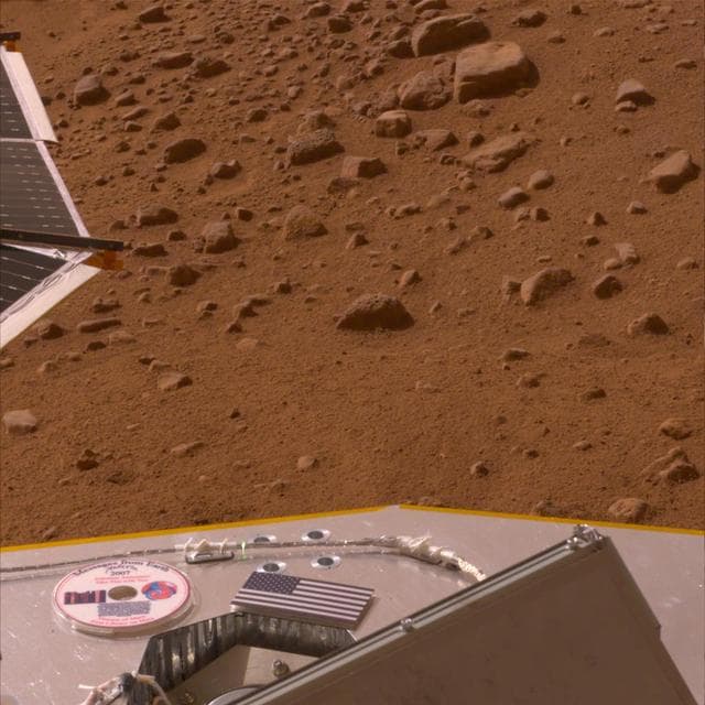 NASA image: American Flag and Mini-DVD Attached to Deck of Phoenix