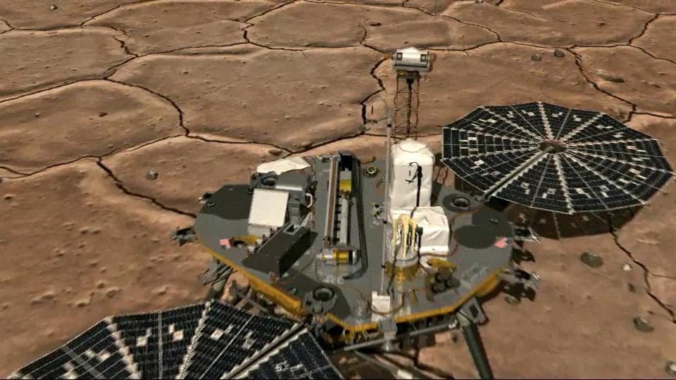 NASA image: View from Above of Phoenix Stowed Robotic Arm Camera
