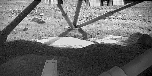 NASA image: Hard Substrate, Possibly Ice, Uncovered Under the Mars Lander