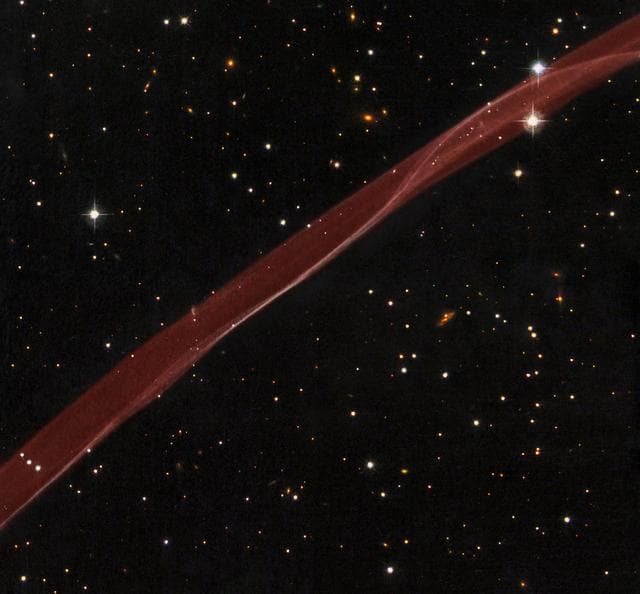 NASA image: Hubble Sees Stars and a Stripe in Celestial Fireworks