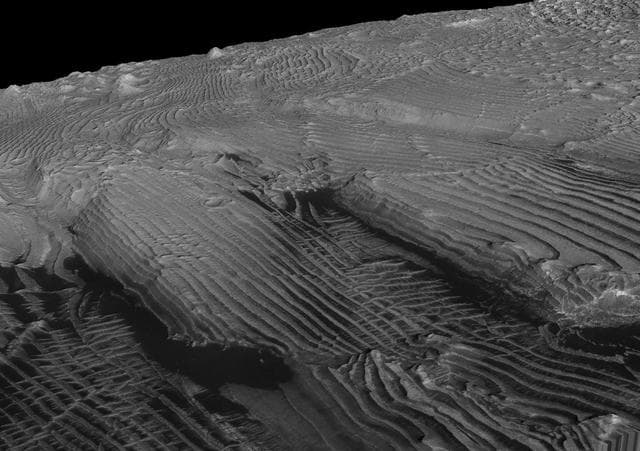 NASA image: Periodic Layering in Martian Sedimentary Rocks, Oblique View